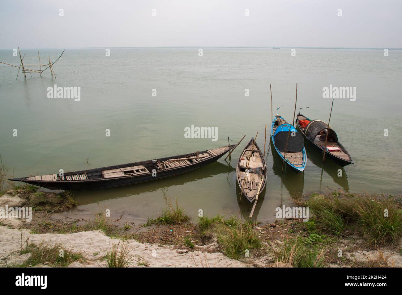 Some wooden fishing boats on the bank of the Padma river Stock Photo ...