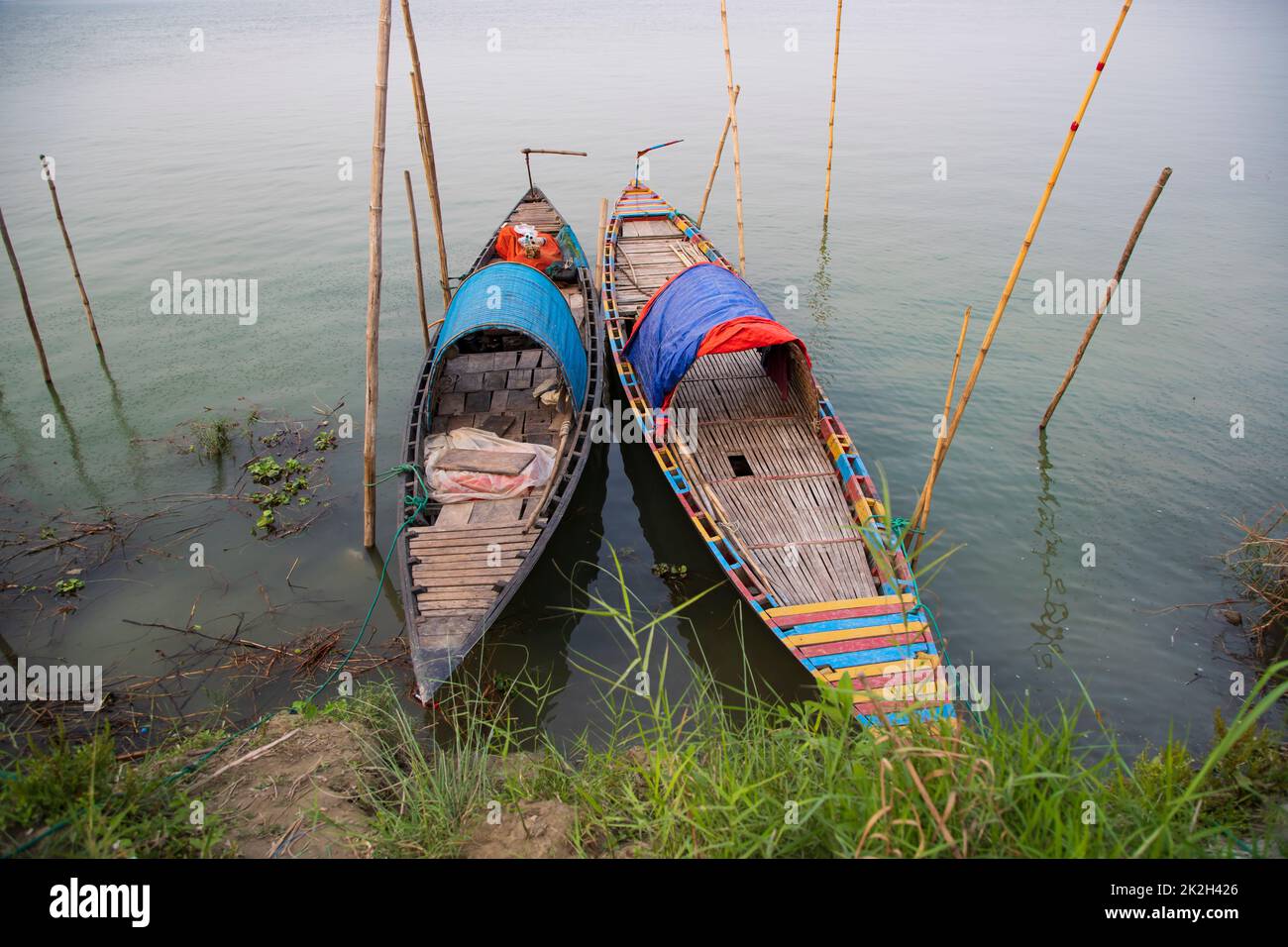 Two wooden fishing boats on the bank of the Padma river Stock Photo - Alamy