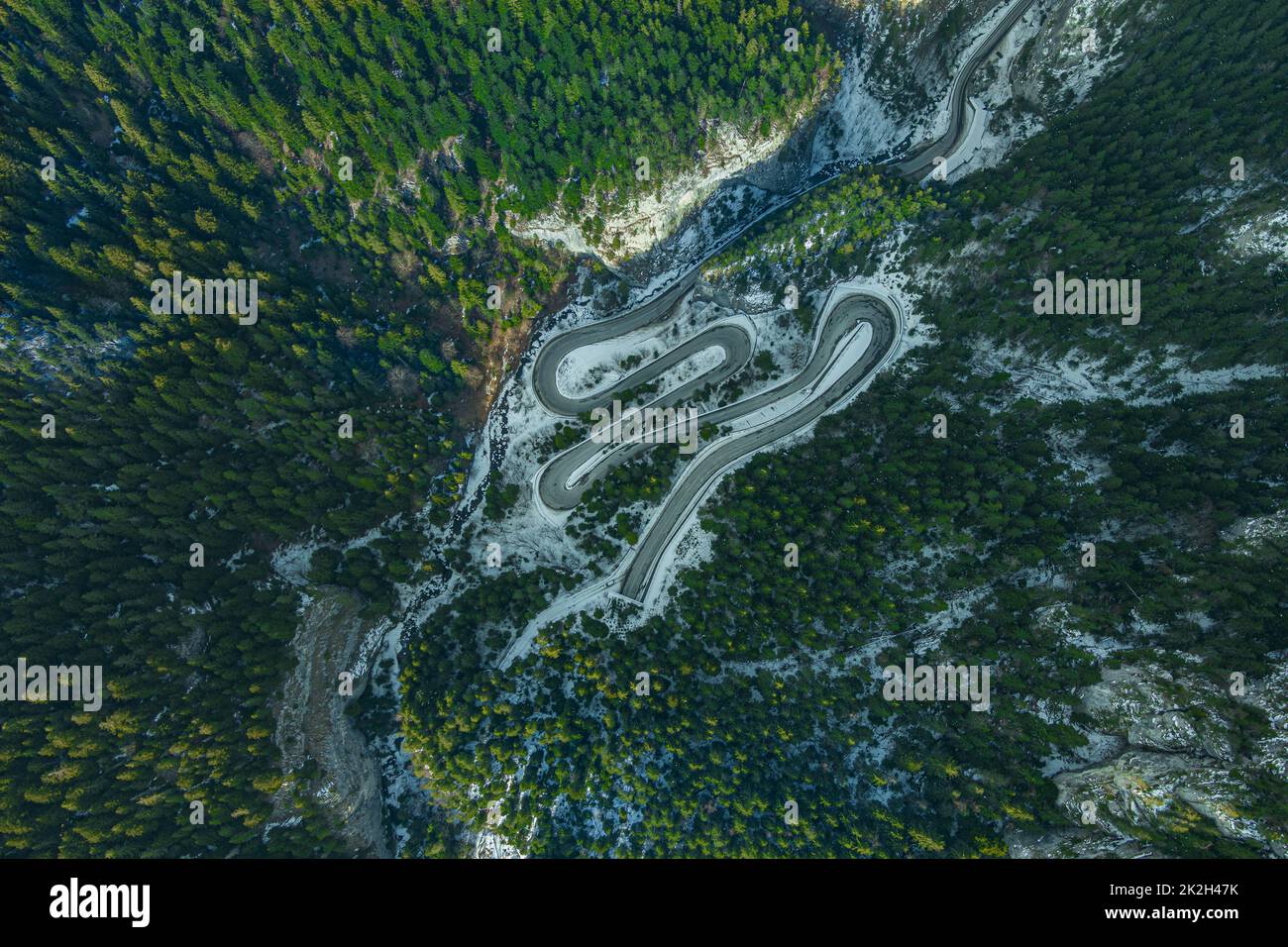 Aerial drone view of a mountain road serpentine Stock Photo