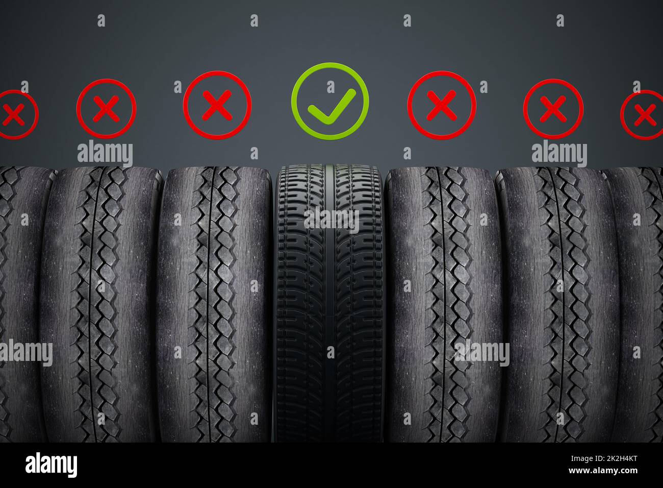 New car tire with green check mark standing out among old tires Stock