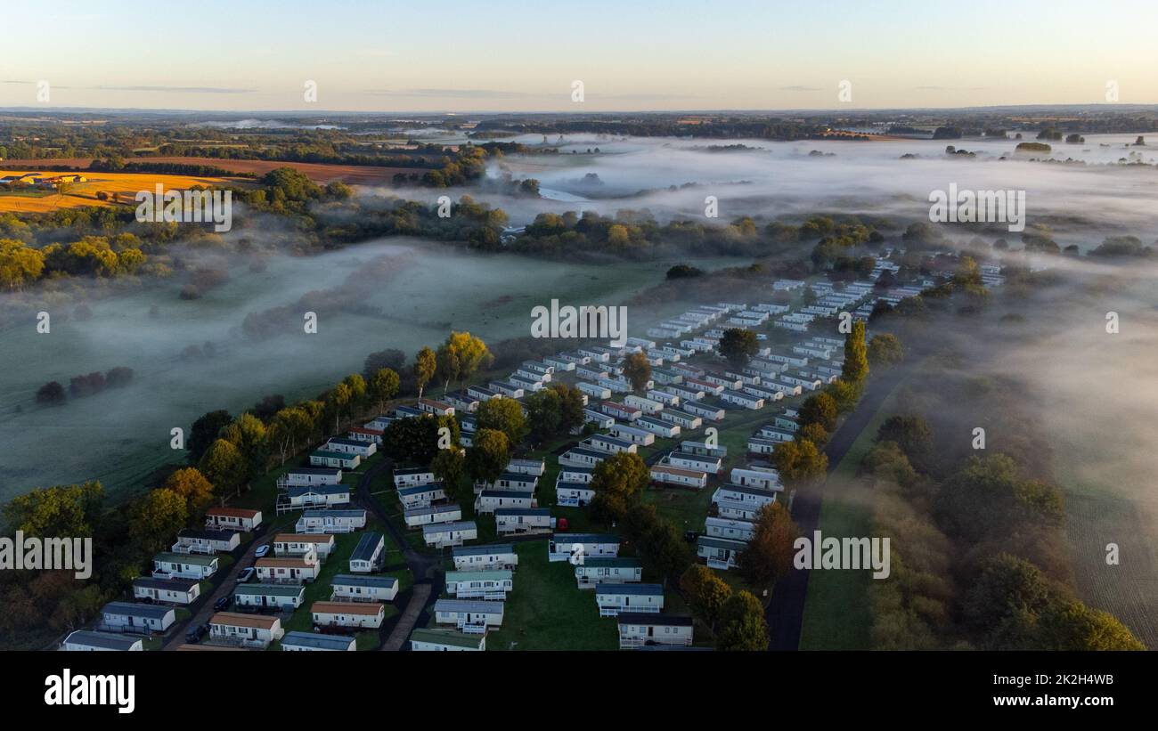 Ripon, North Yorkshire, UK. 23rd Sep, 2022. An aerial view of a misty valley in North Yorkshire at the start of Autumn. Credit: Mick Flynn/Alamy Live News Stock Photo