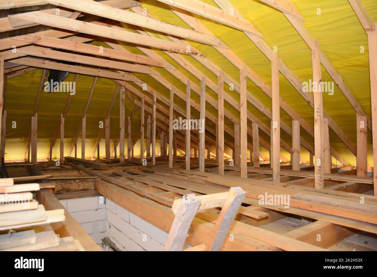 Roofing Construction Interior. Wooden Roof Beams, Wooden Frame, Rafters, Trusses,  House Attic Construction. Stock Photo