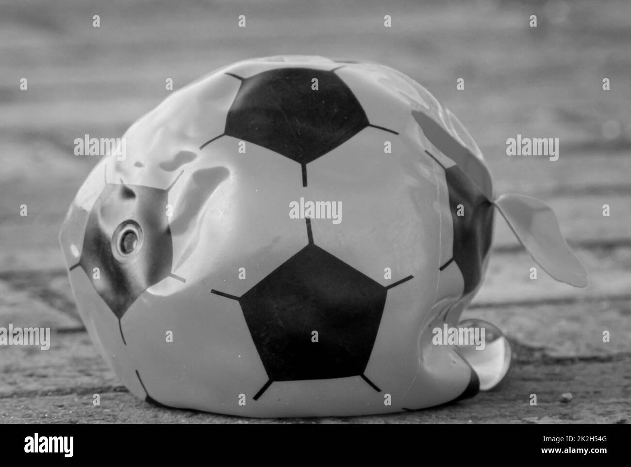 The air is out of a soccer. Stock Photo