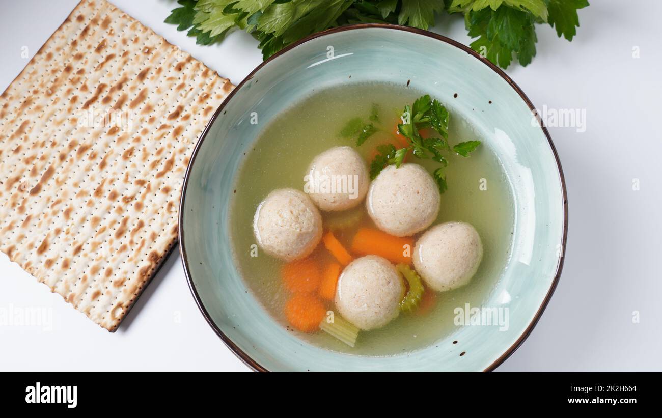 Jewish chicken broth with kneidlach (balls made with matzo meal)Matzo ball soup Stock Photo