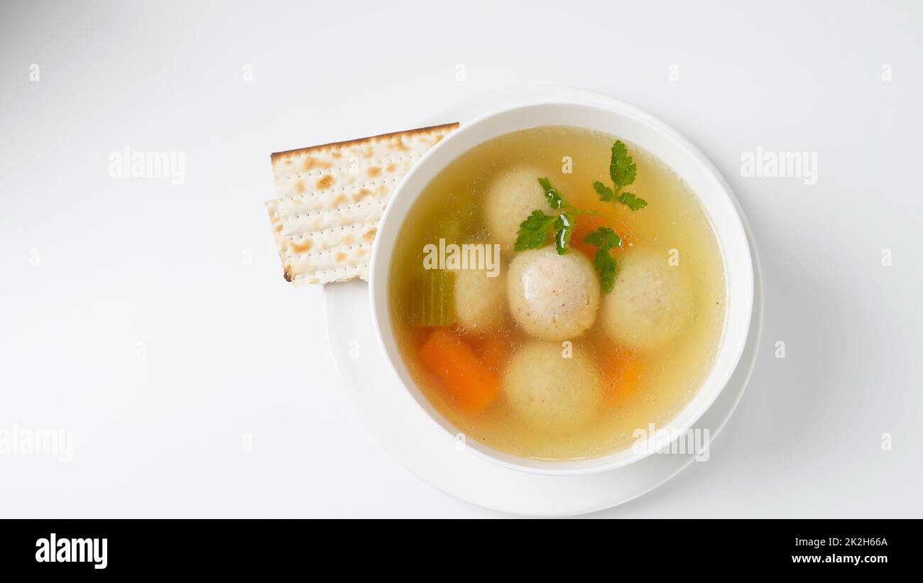 Jewish chicken broth with kneidlach (balls made with matzo meal)Matzo ball soup Stock Photo