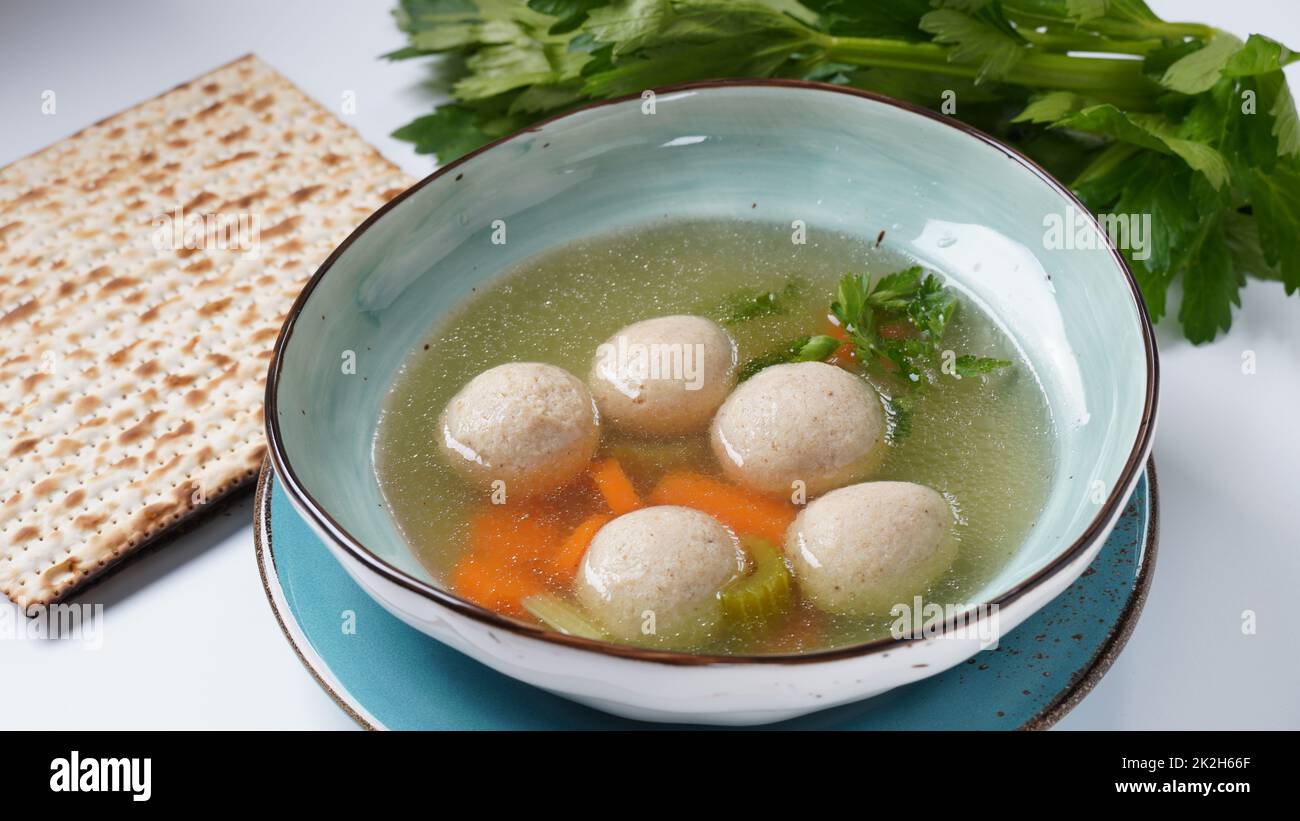 Jewish chicken broth with kneidlach (balls made with matzo meal)Matzo ball soup Stock Photo