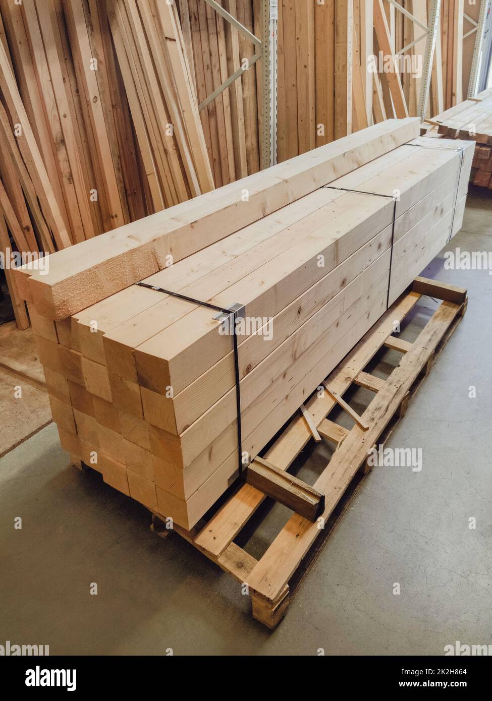 stacked wooden boards in a woodworking industry. stacks with pine lumber. folded edged board. wood harvesting shop. timber for construction, increase in timber prices Stock Photo