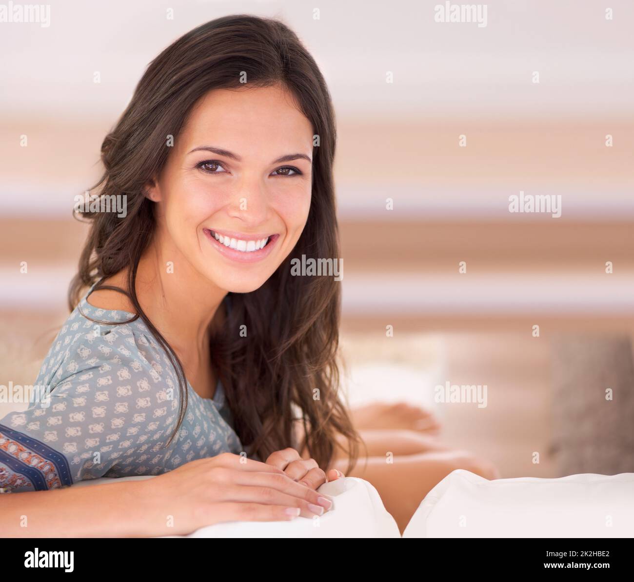 Taking a day to put my feet up. a young woman on a couch Stock