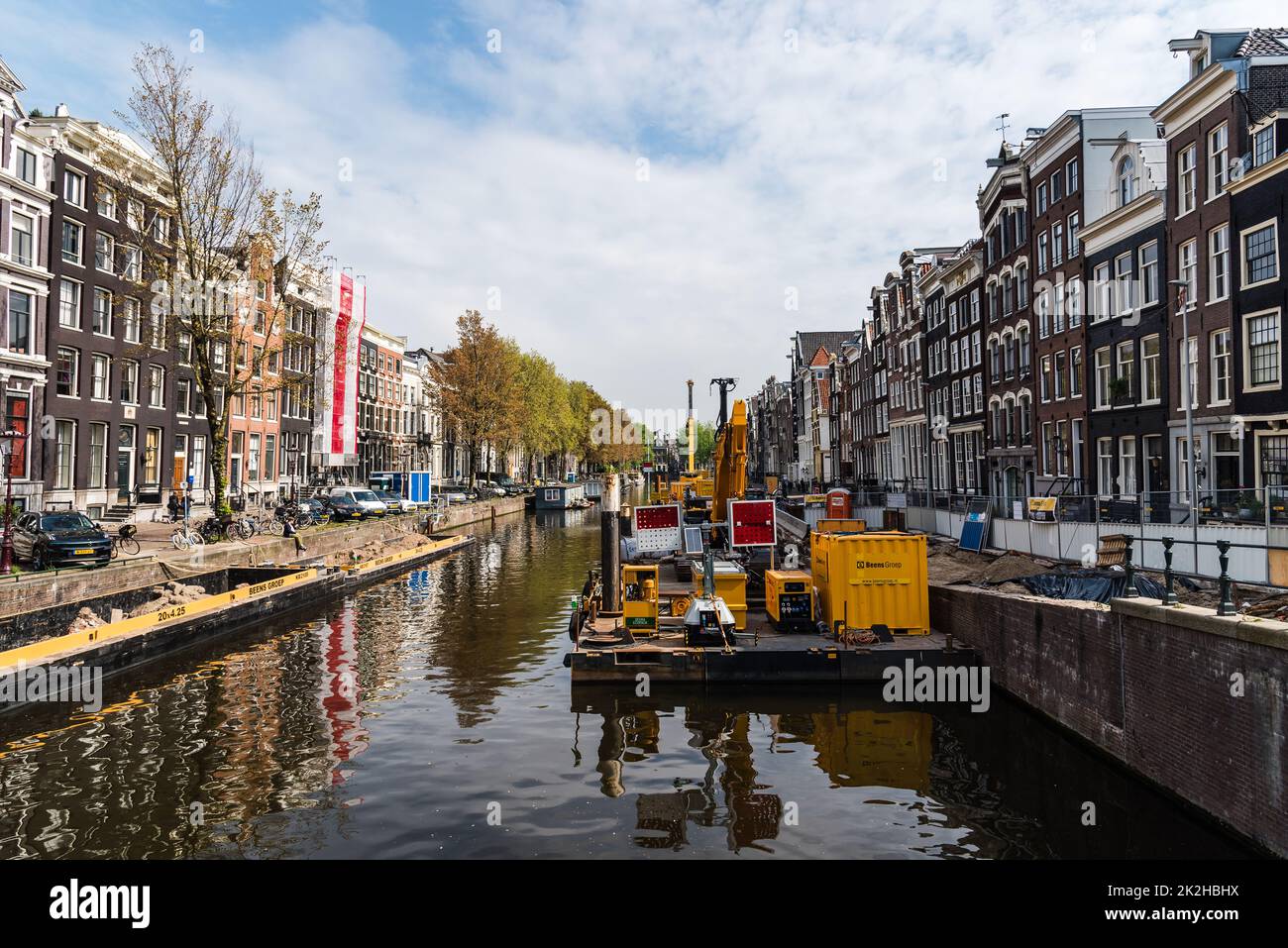 Amsterdam, Netherlands - May 7, 2022: Dredger barge carrying out maintenance and cleaning of a canal Stock Photo