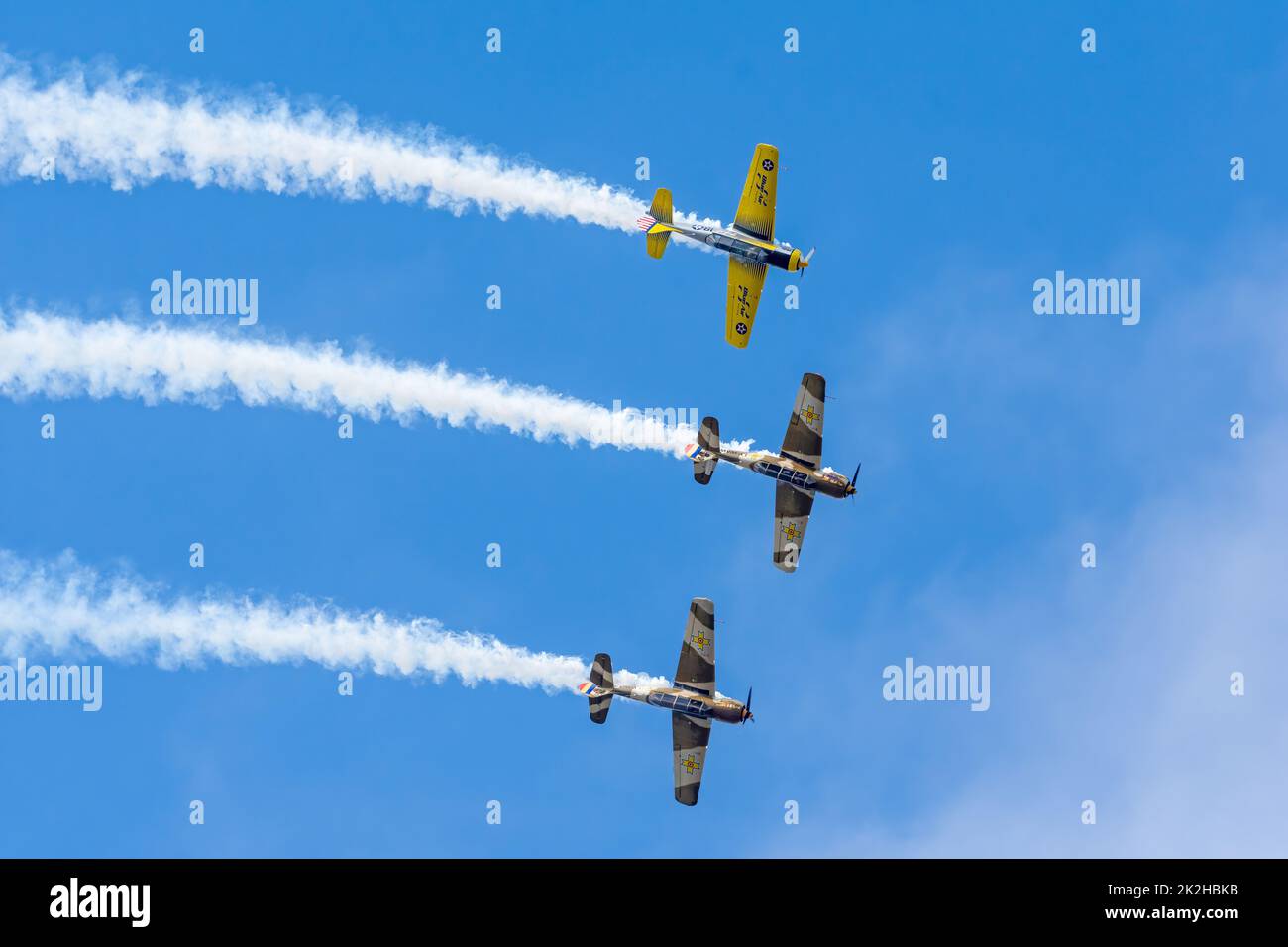 Bucharest, Romania, 4 Sep 2022: Airshow with planes performing acrobatic flight on blue sky, Aeroclubul Romanieie aerobatic team Stock Photo