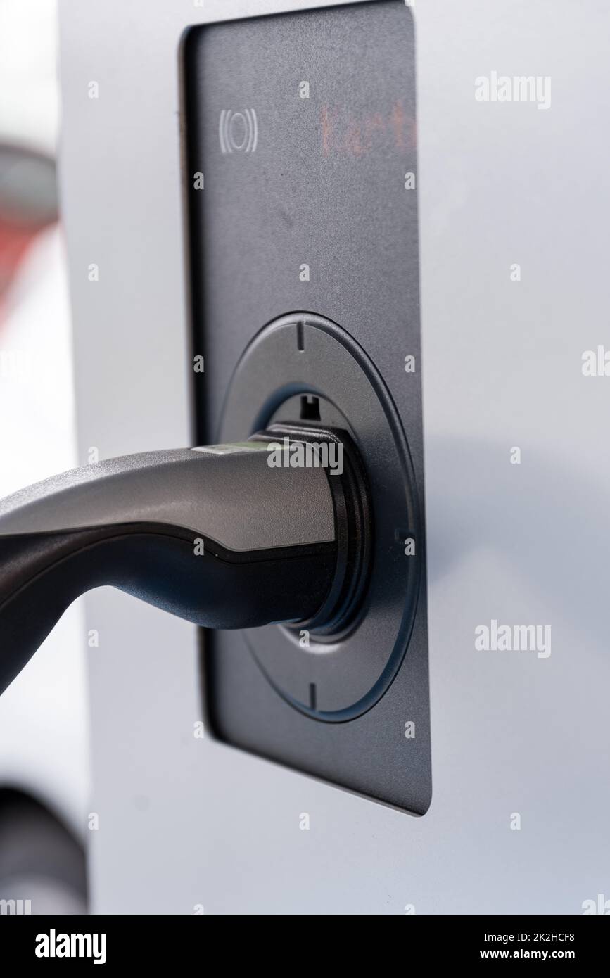 Electric car charging the battery - charging station e-car close-up Stock Photo