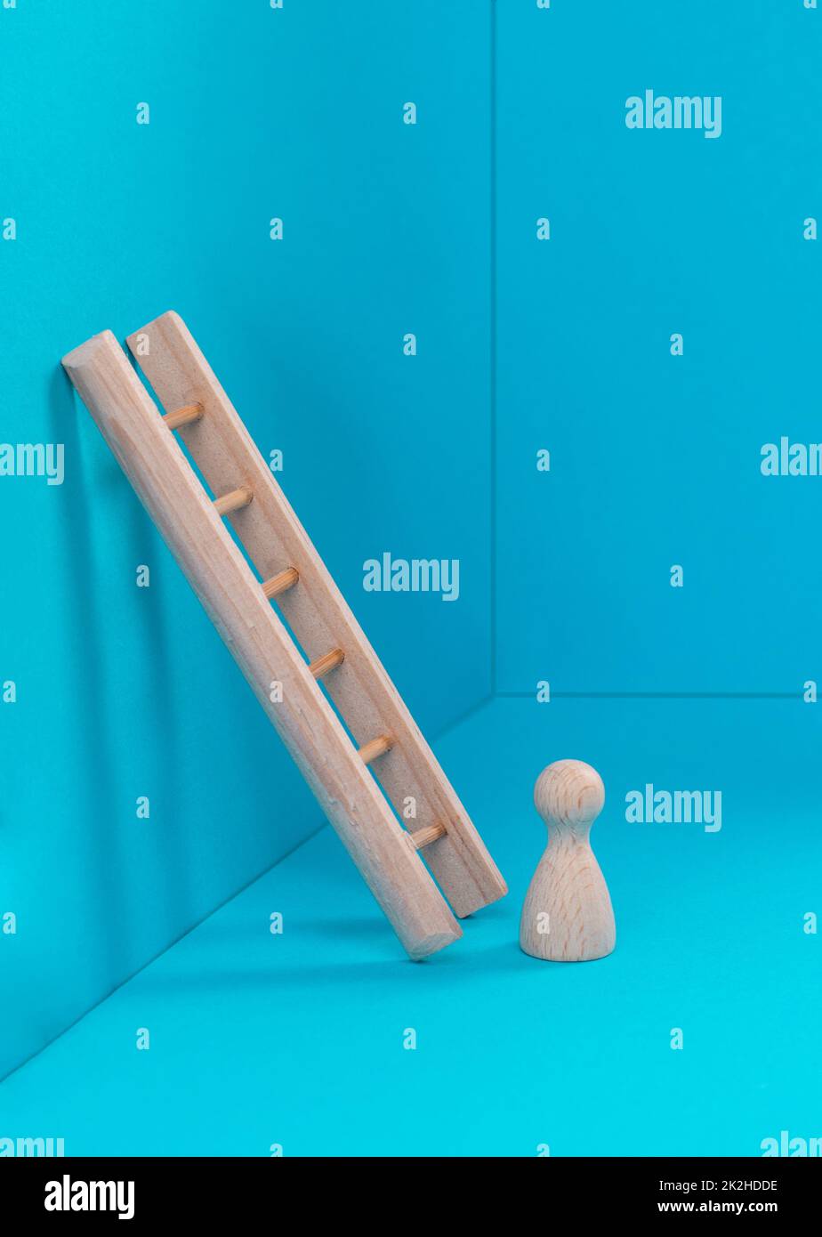 Man is standing next to a ladder, climbing up in career, having a goal ...