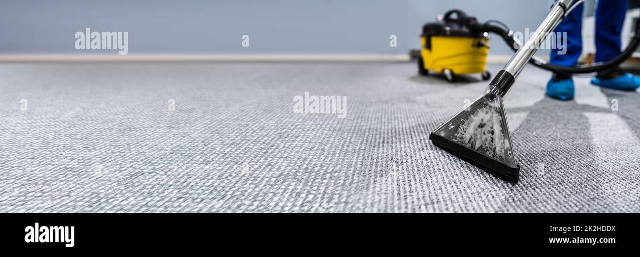 Person Cleaning Carpet With Vacuum Cleaner Stock Photo - Alamy