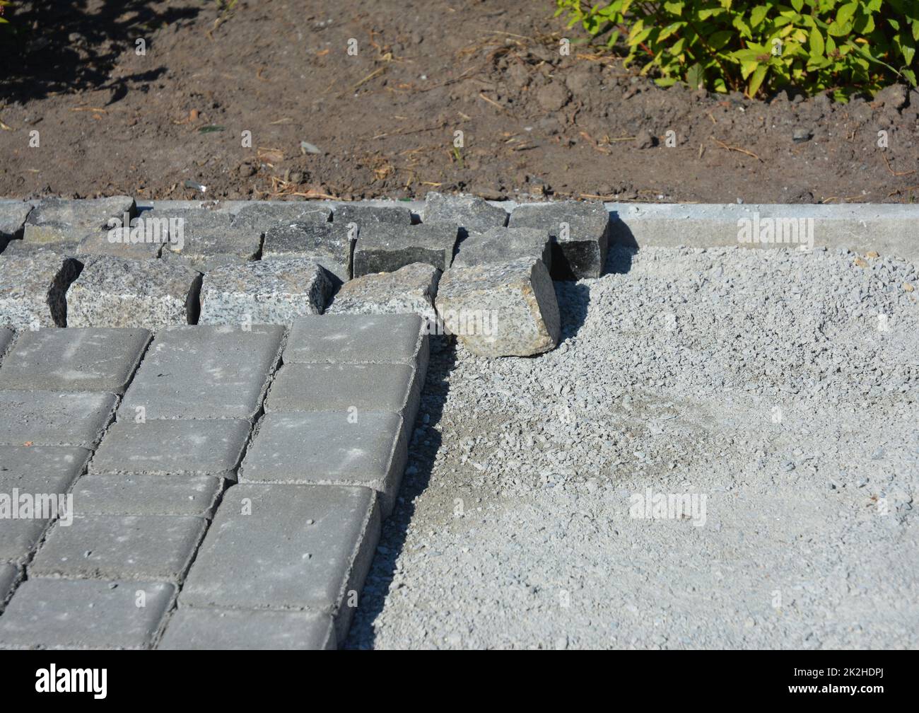 Close up on building stone pathway construction outdoor. Stock Photo