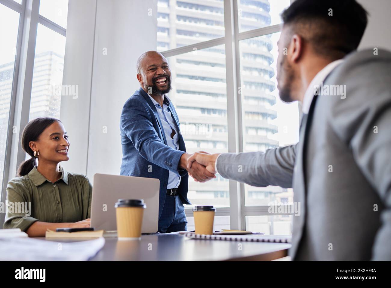 Are you ready to get started. Shot of two business people shaking hands during a meeting. Stock Photo