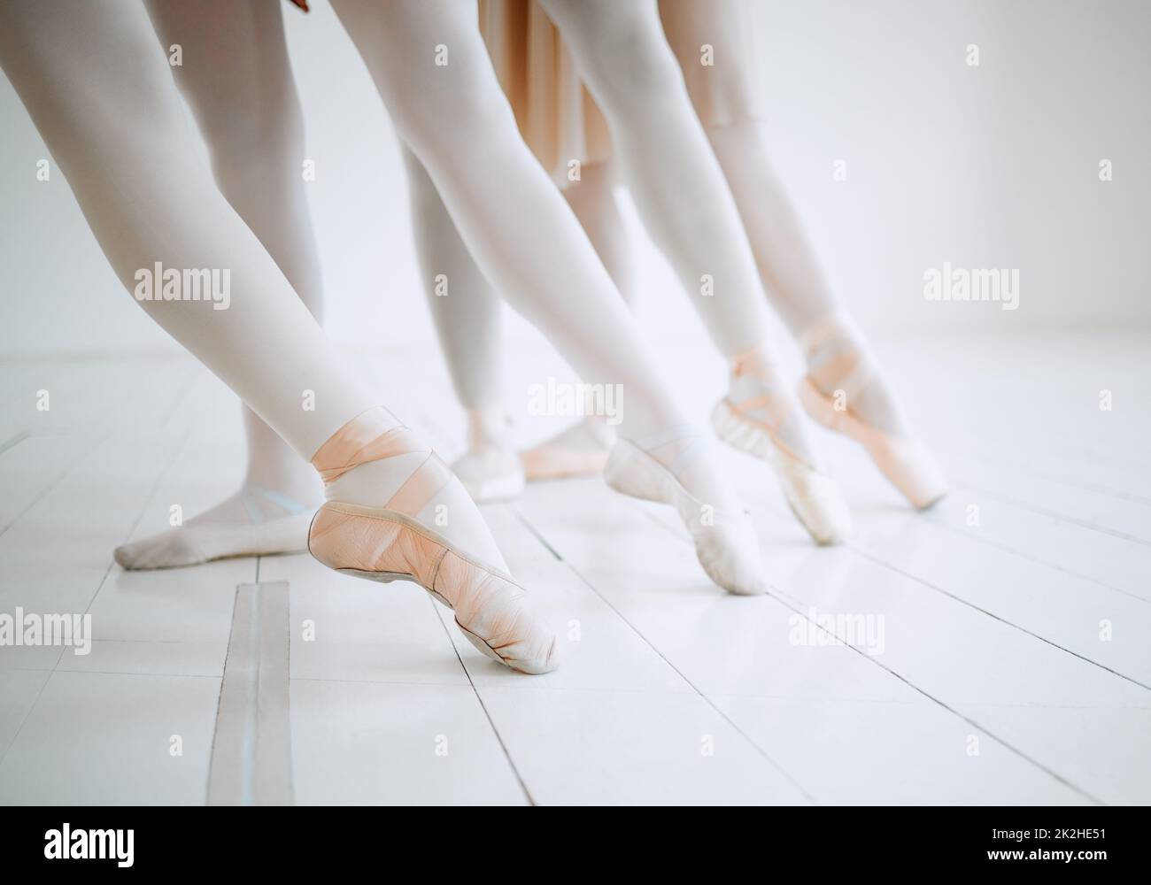 Dance with your heart and your feet will follow. Shot of a group of ballerinas with toes pointed. Stock Photo