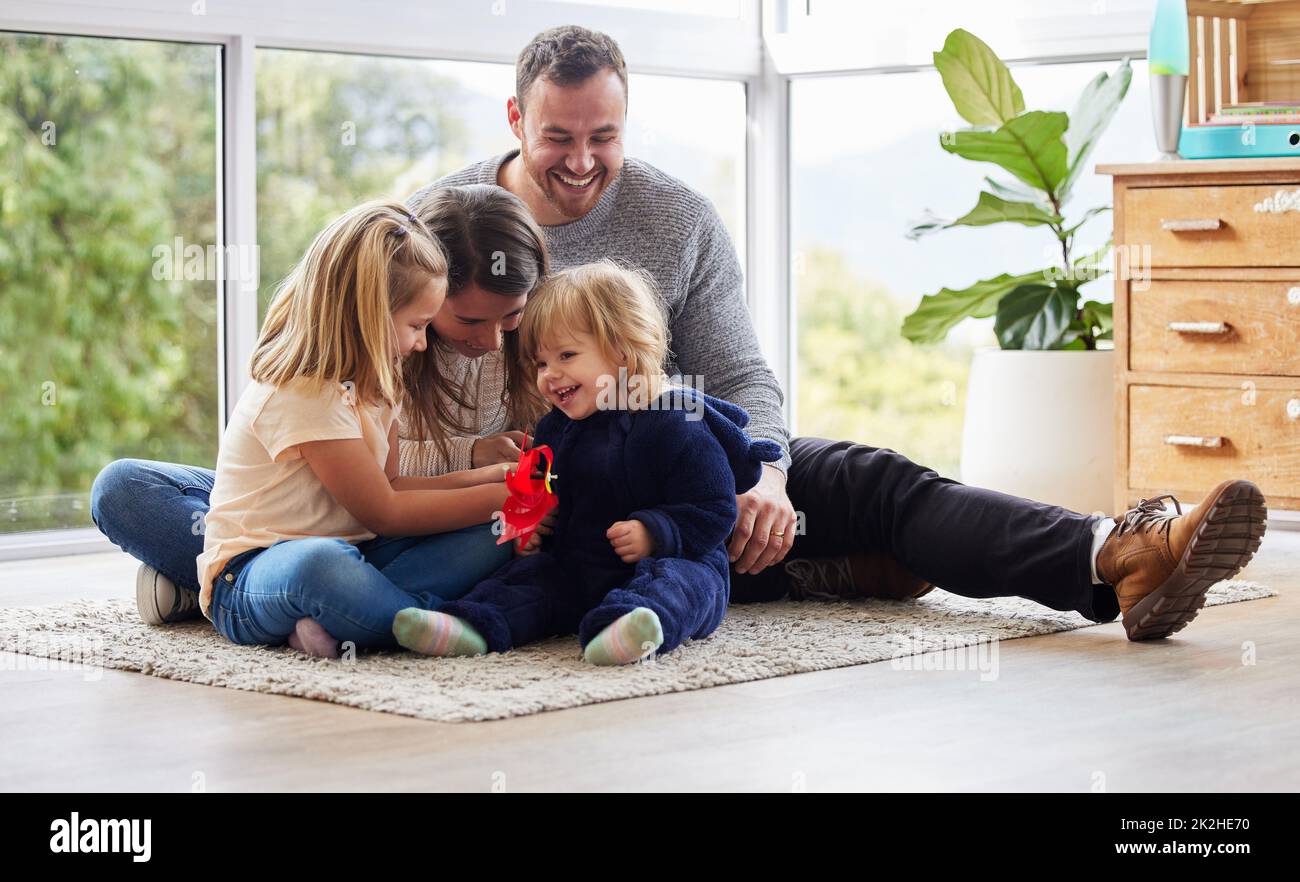 These are the times well cherish forever. Shot of a young family playing together at home. Stock Photo