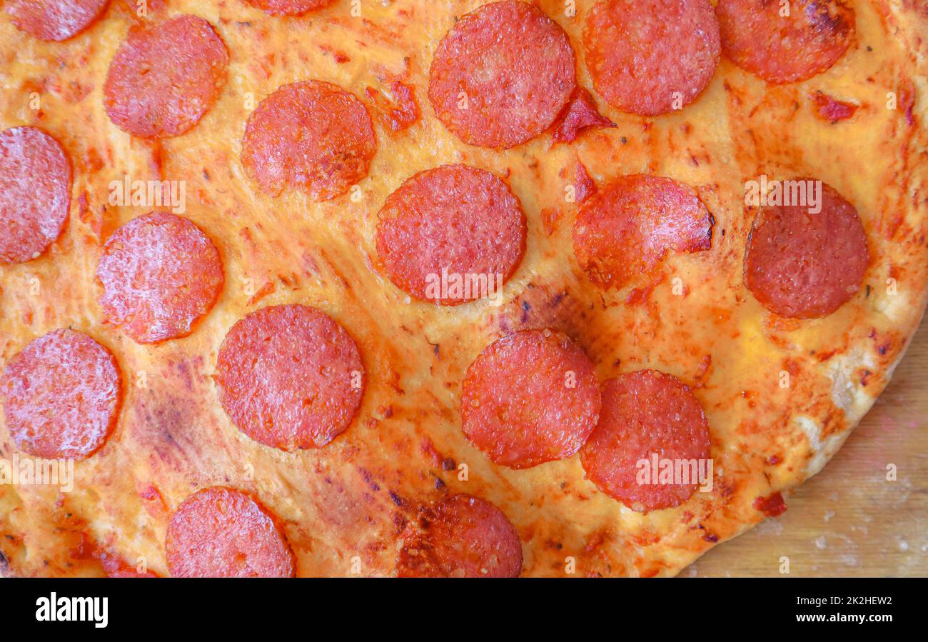 Background of delicious pepperoni pizza macro photography of a pizza