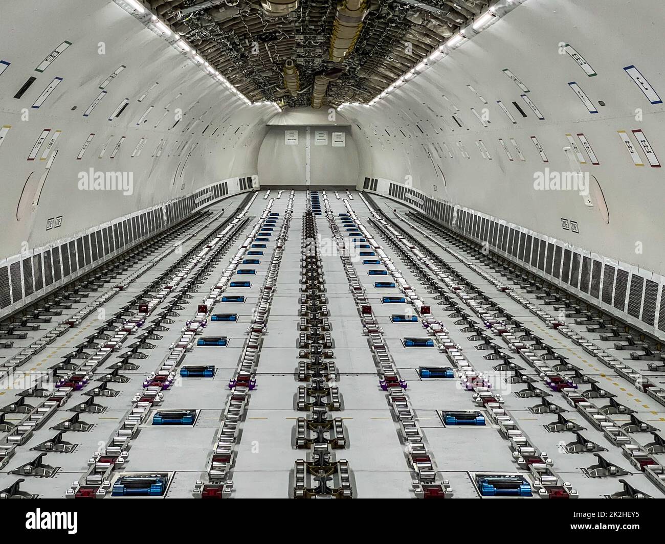 Cargo Airplane - view inside the main deck cargo compartment on a freshly converted wide-body freighter aircraft Stock Photo