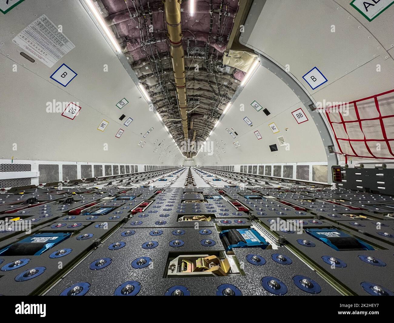 Cargo Airplane - view inside the main deck cargo compartment on a freshly converted wide-body freighter aircraft Stock Photo