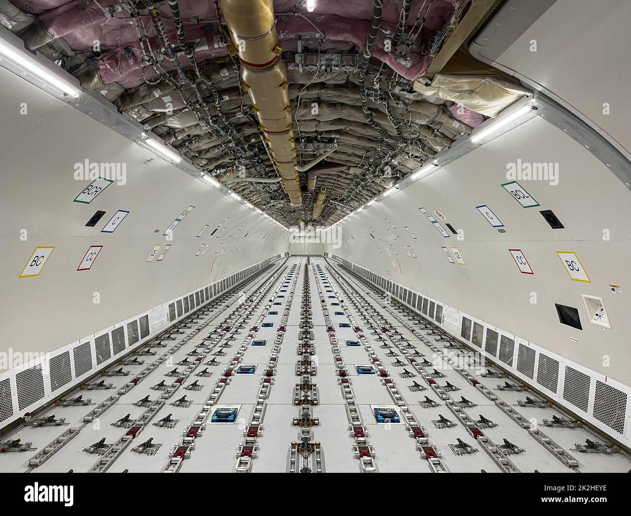Cargo Airplane - view inside the main deck cargo compartment on a freshly converted wide-body freighter aircraft Stock Photo