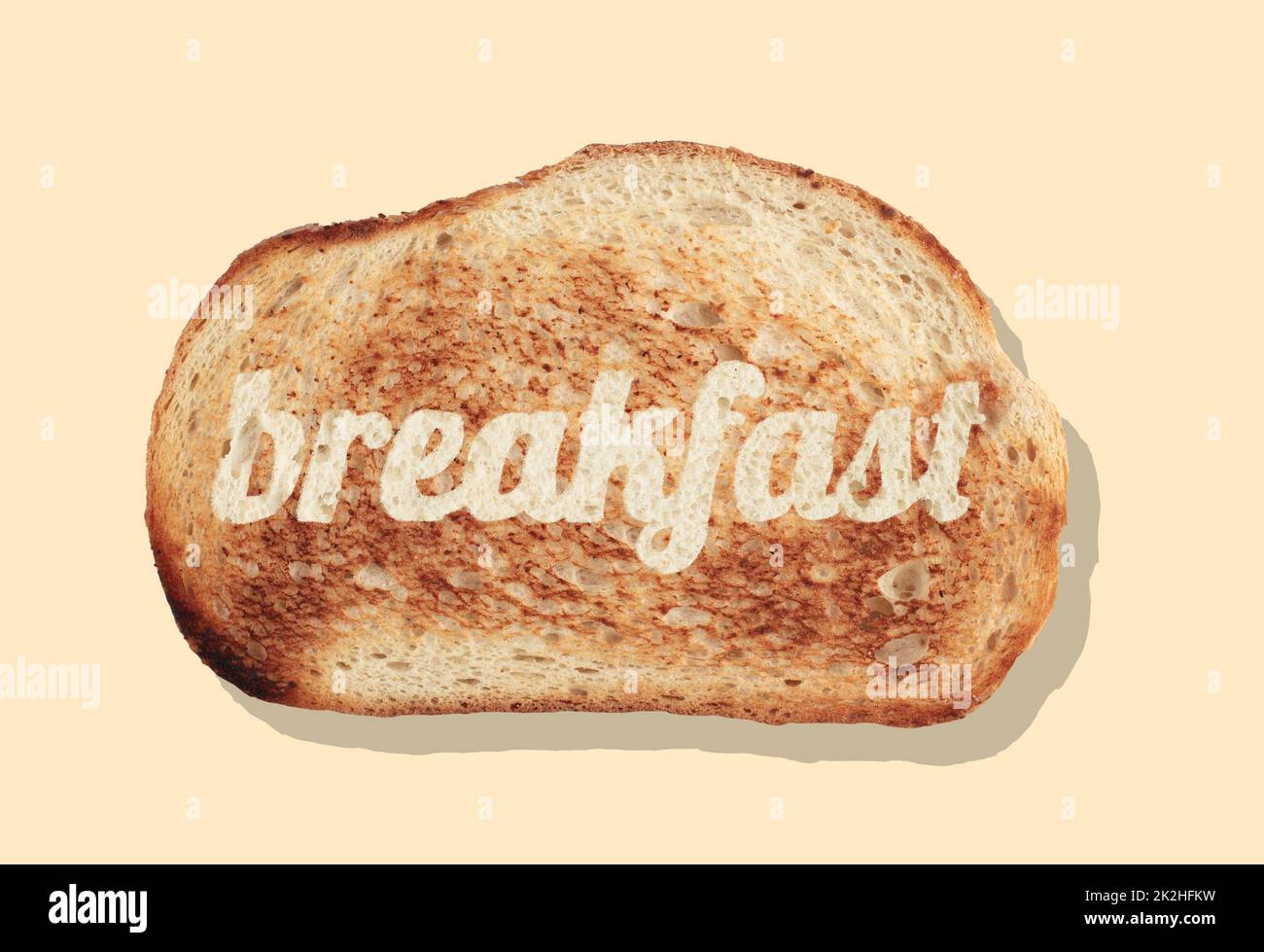 slice of bread with word breakfast on it isolated on light brown