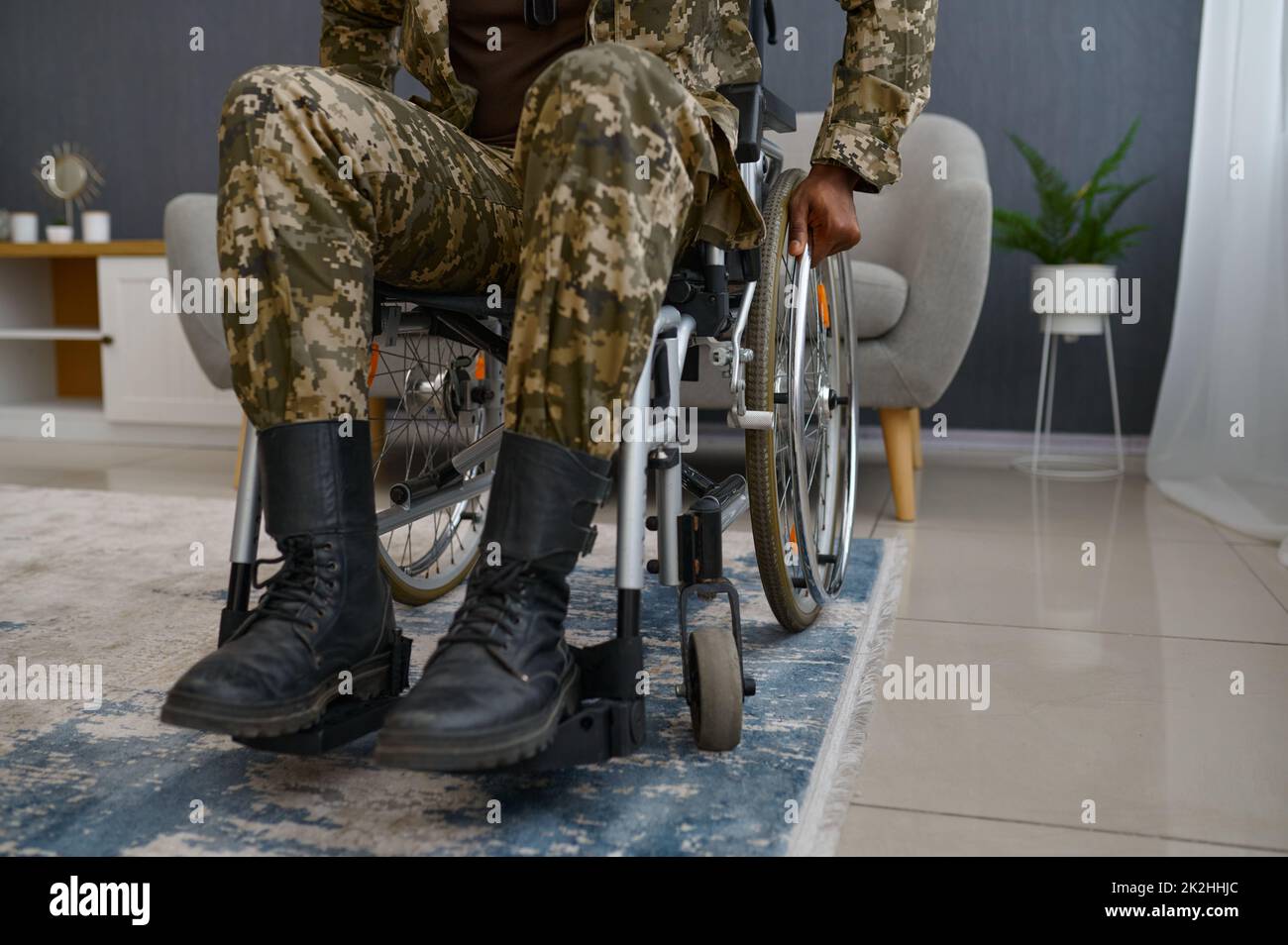 War veteran with disability sitting in wheelchair Stock Photo