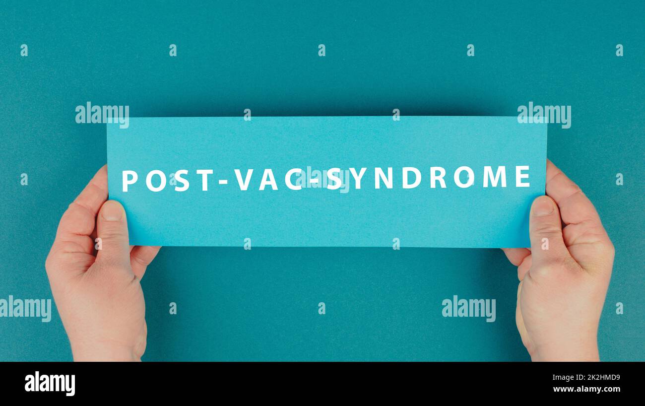 The words post vac syndrome are standing on a paper, covid-19 vaccine damage and side effects, pandemic jab Stock Photo