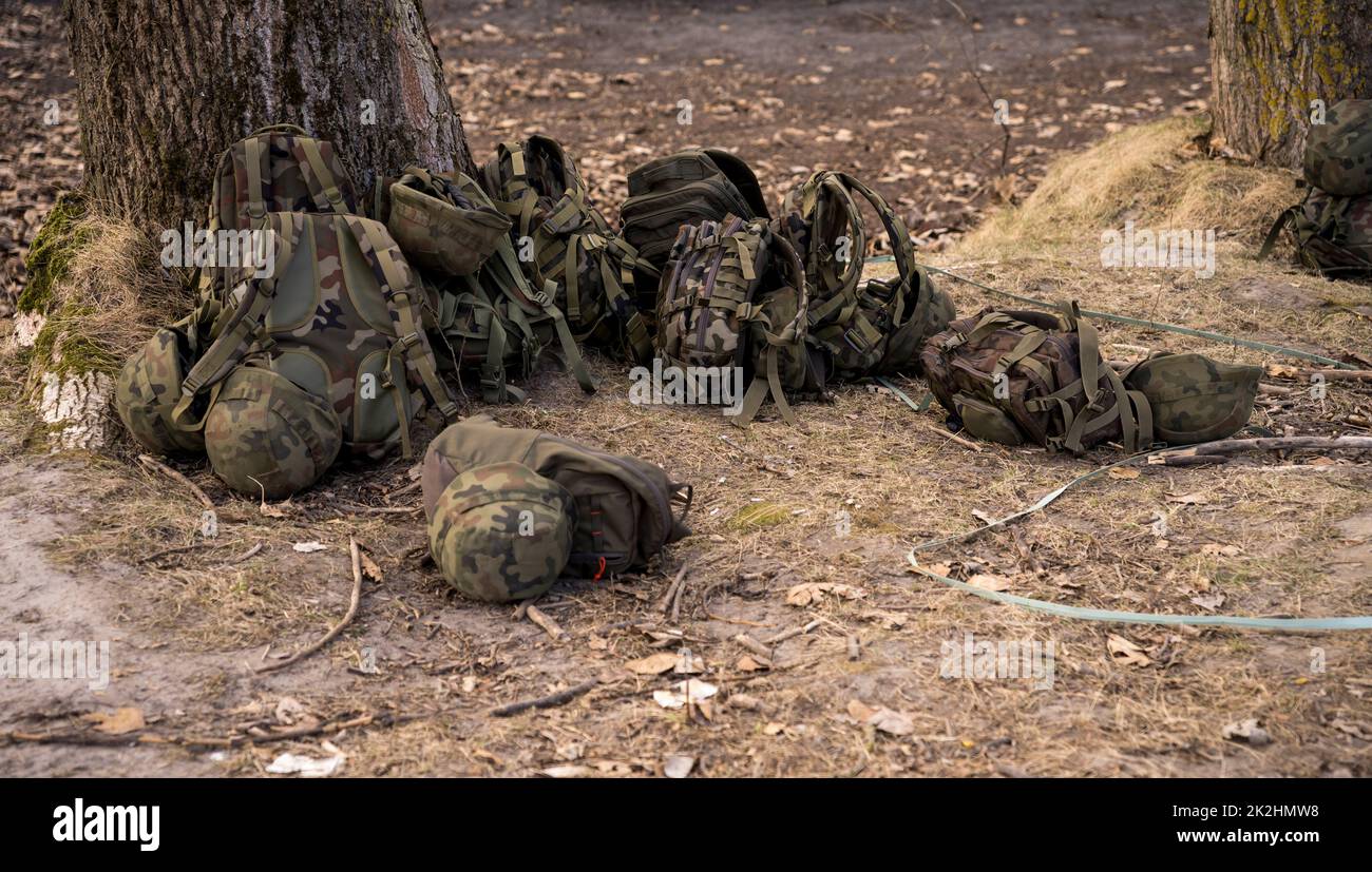 military backpacks lying on the ground Stock Photo Alamy