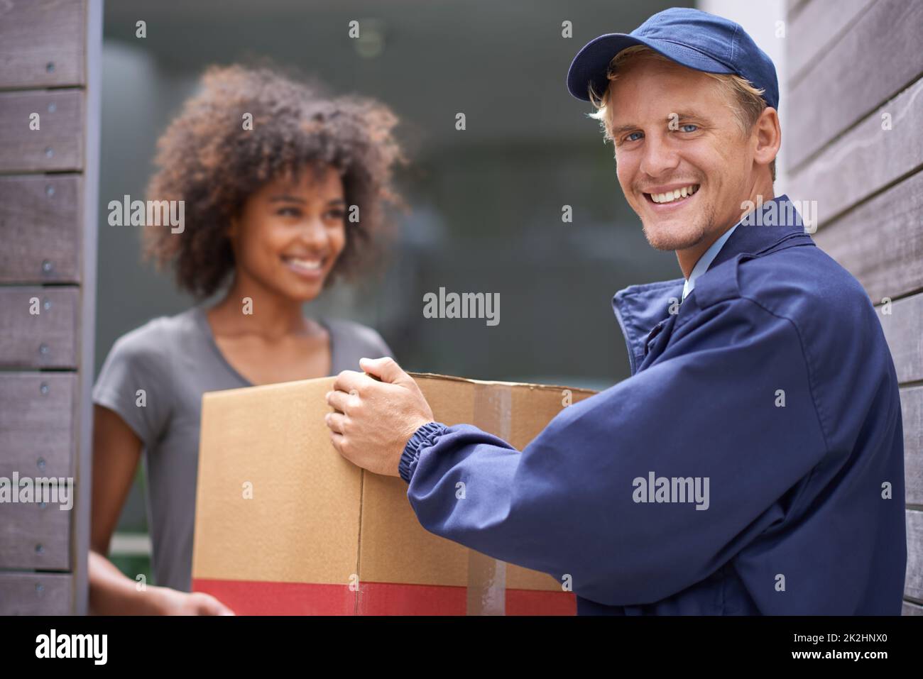 Delivering direct to your door. Shot of a courier making a delivery to