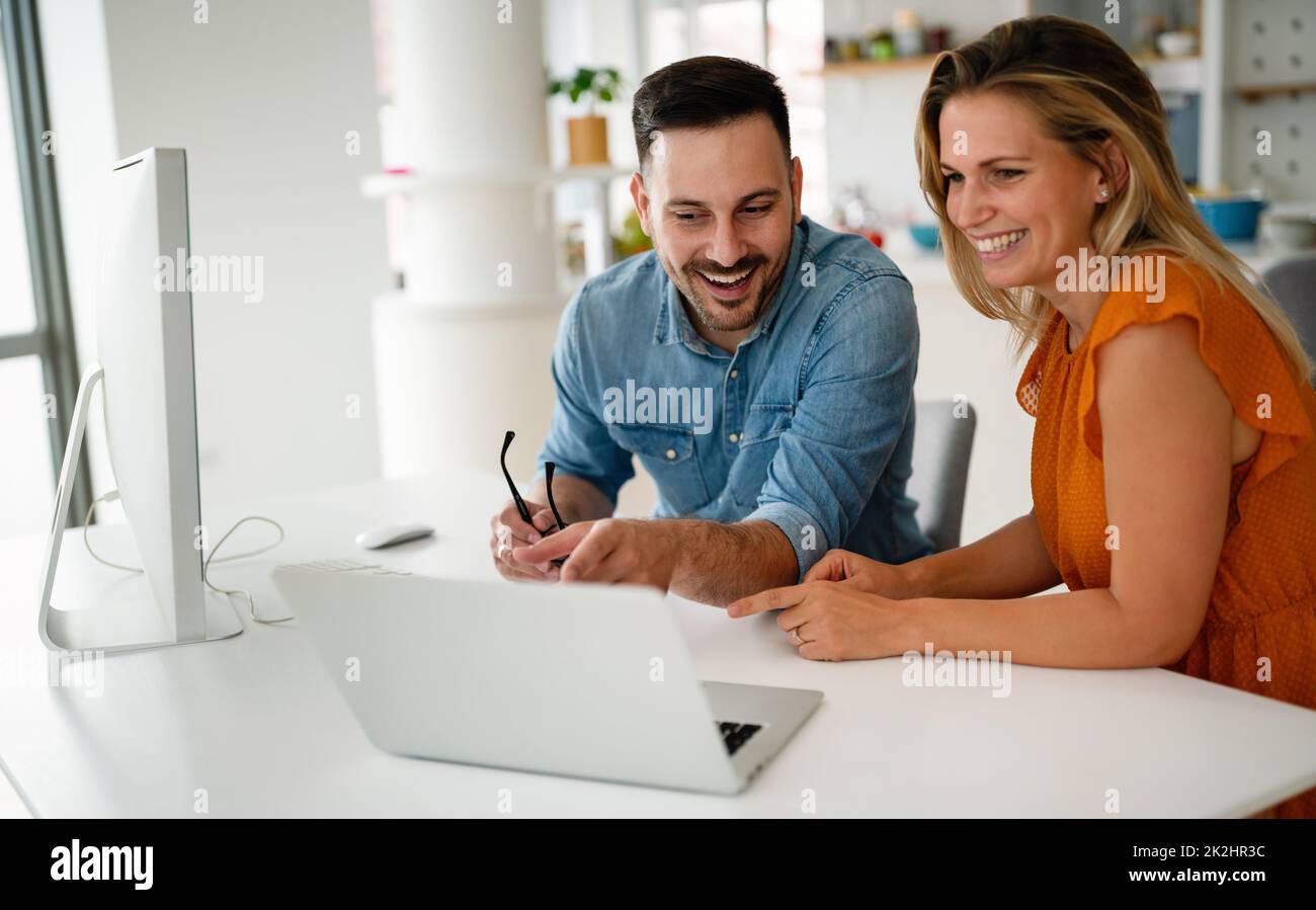 Programmers cooperating at IT company developing apps Stock Photo
