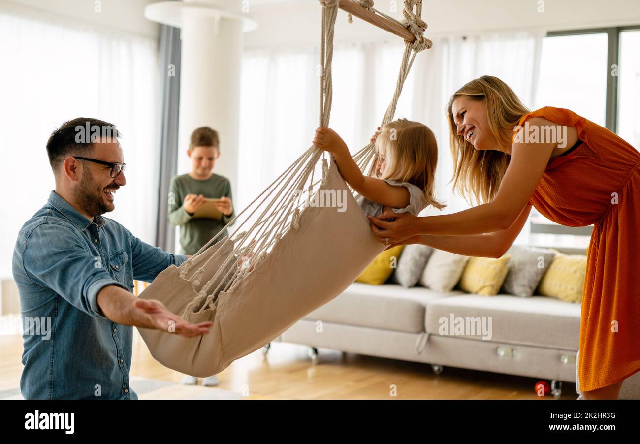 Happy family having fun time at home. Parents children love happiness concept. Stock Photo