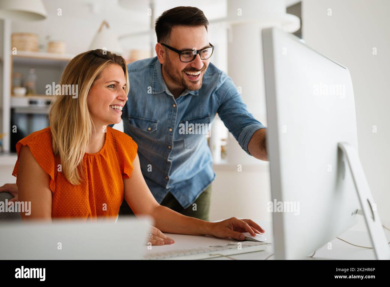 Programmers cooperating at IT company developing apps Stock Photo