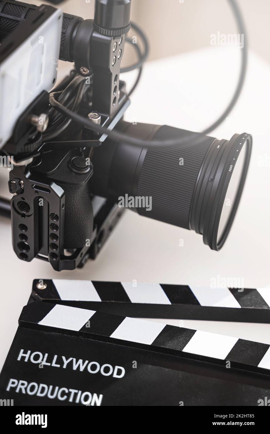 Modern mirrorless camera rig and clapperboard Stock Photo Alamy