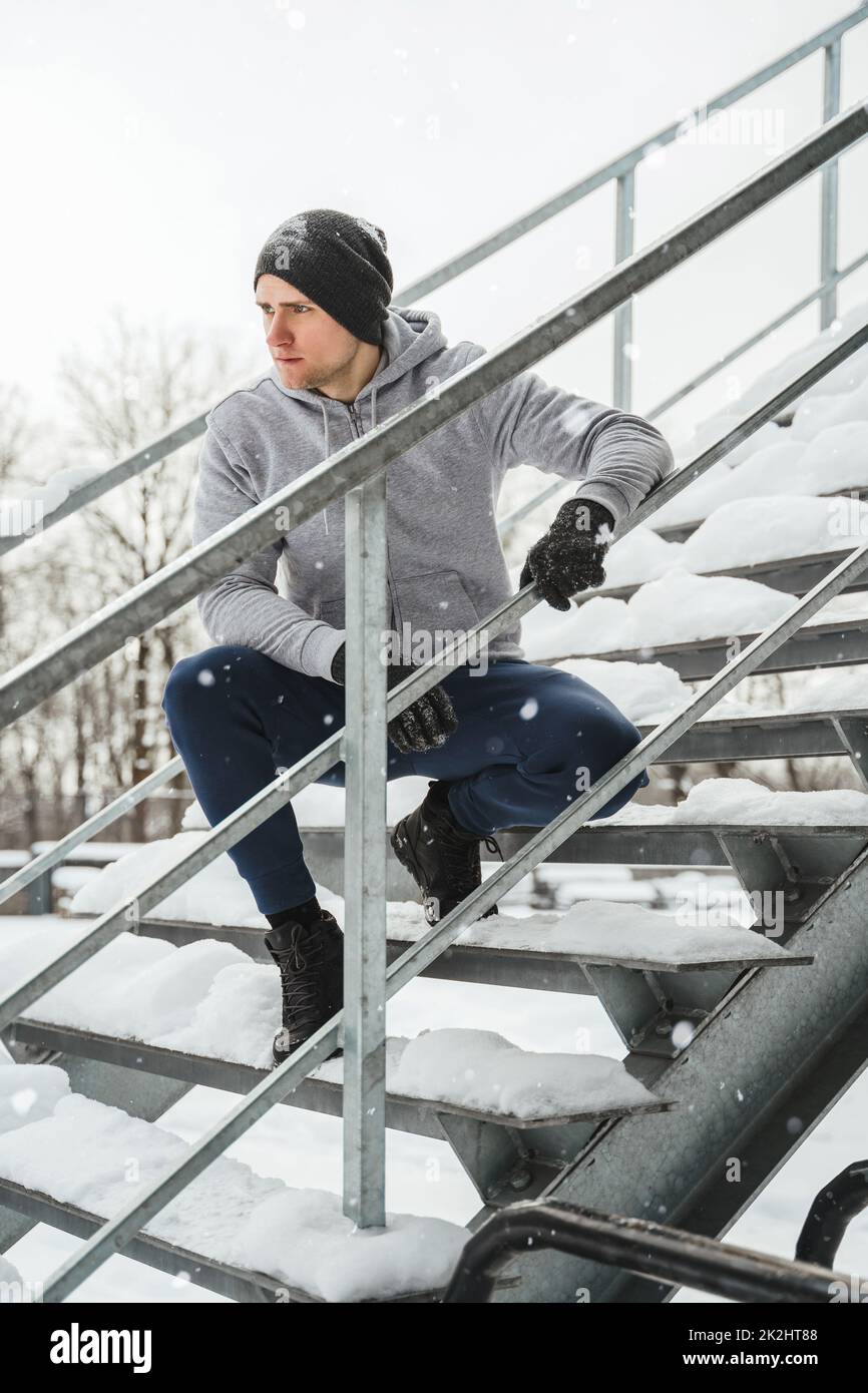 Man sitting on stairs hi-res stock photography and images - Alamy