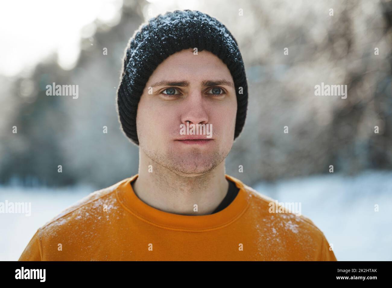 Young jogger man during his workout in winter park Stock Photo