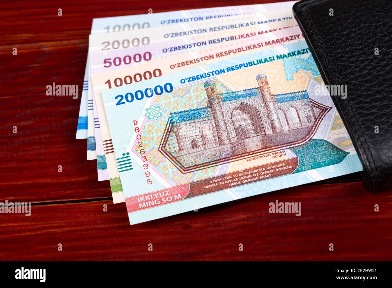 Uzbekistani money - Soum in the black wallet Stock Photo