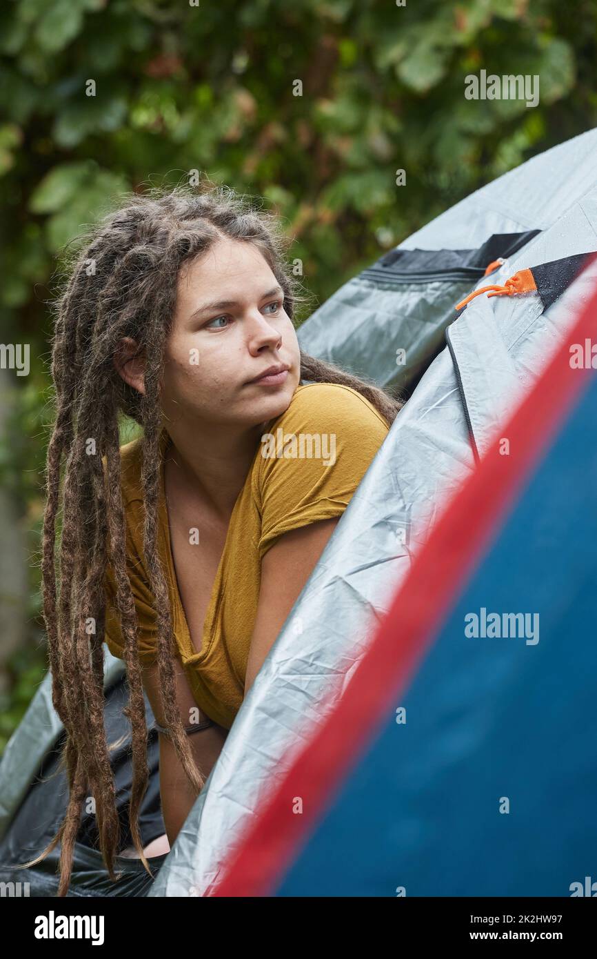Woman getting out the tent Stock Photo