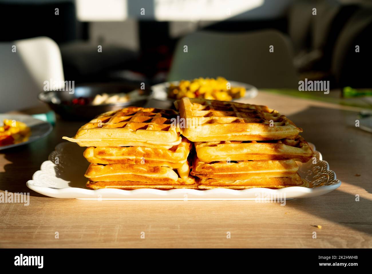 A pile of waffles in a plate on the table Stock Photo