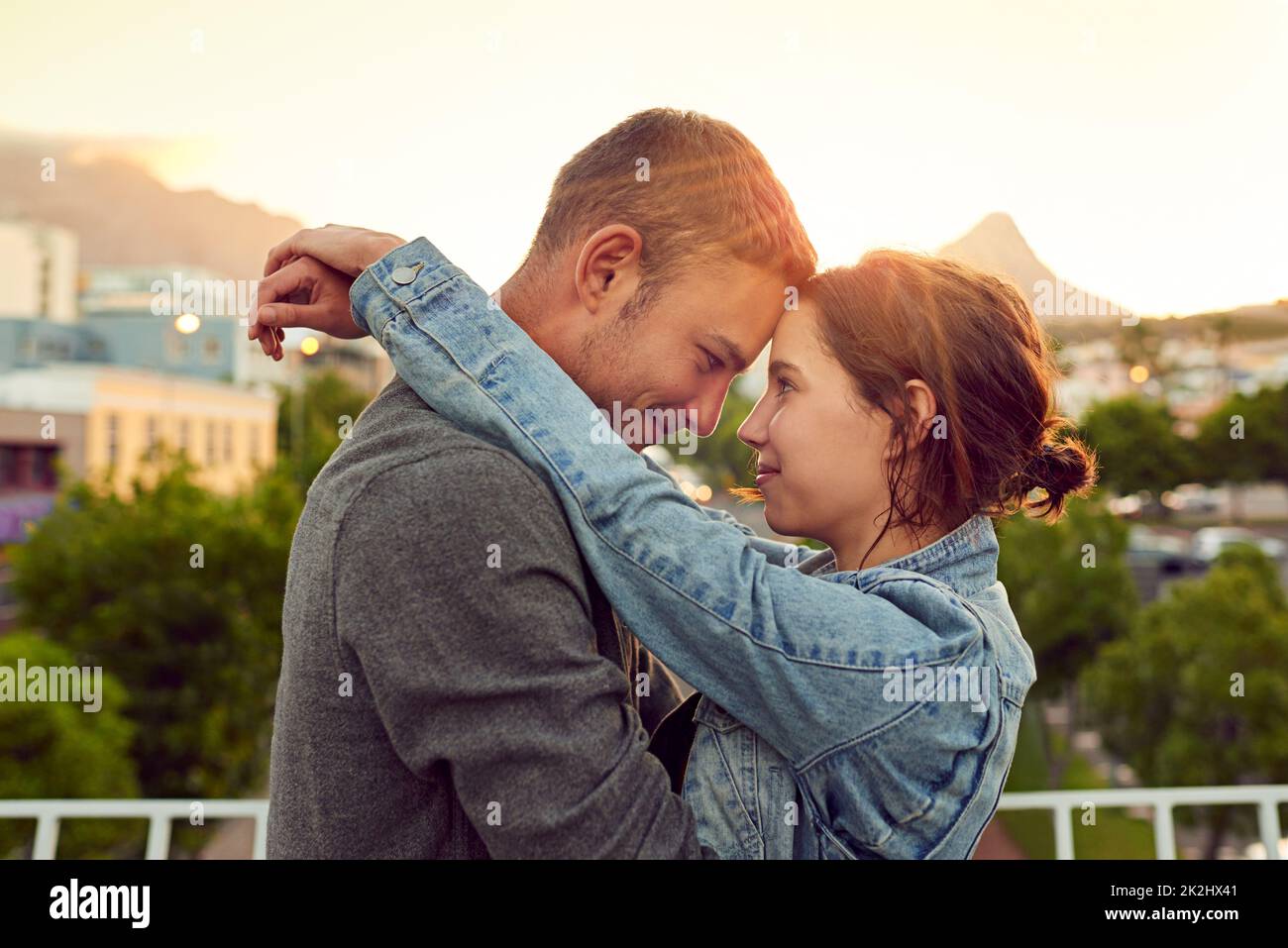 My heart beats for you. Shot of a happy young couple enjoying a romantic moment in the city. Stock Photo