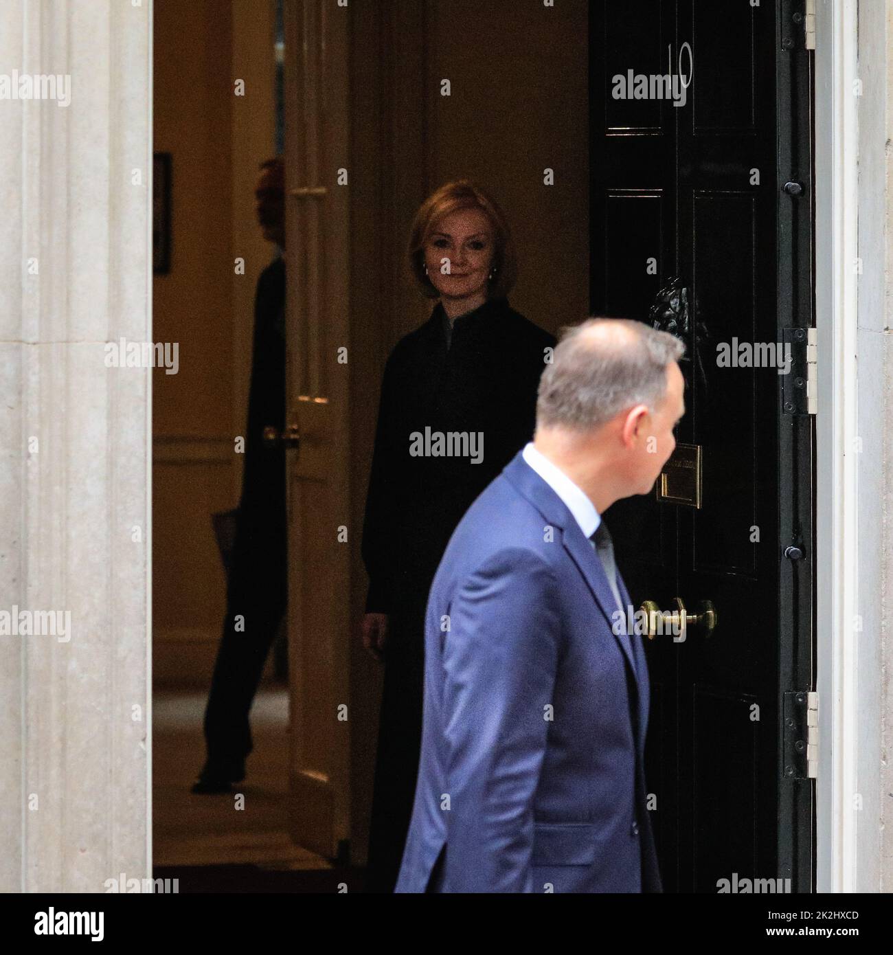 Liz Truss, British Prime Minister, watches Andrzej Duda, President of the Republic of Poland leave after a meeting in Downing Street, London, UK Stock Photo