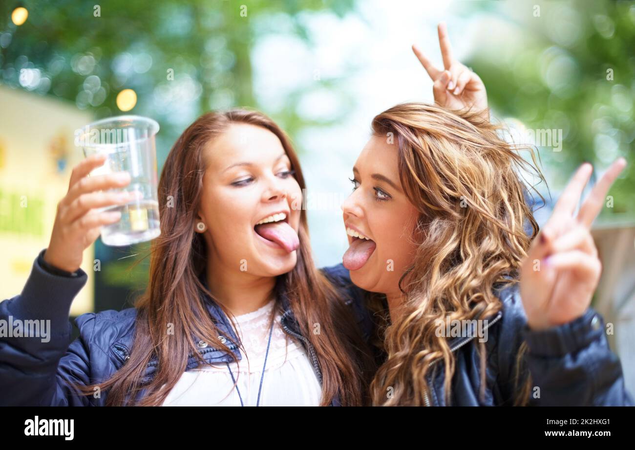 Having fun with my best friend. Two friends having fun at a festival. Stock Photo