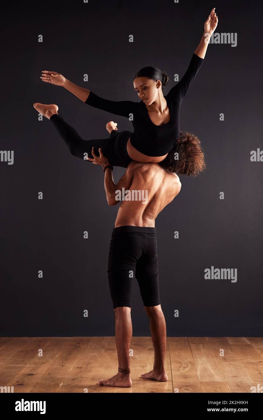 Strength and flight. A female and male contemporary dancer performing a ...