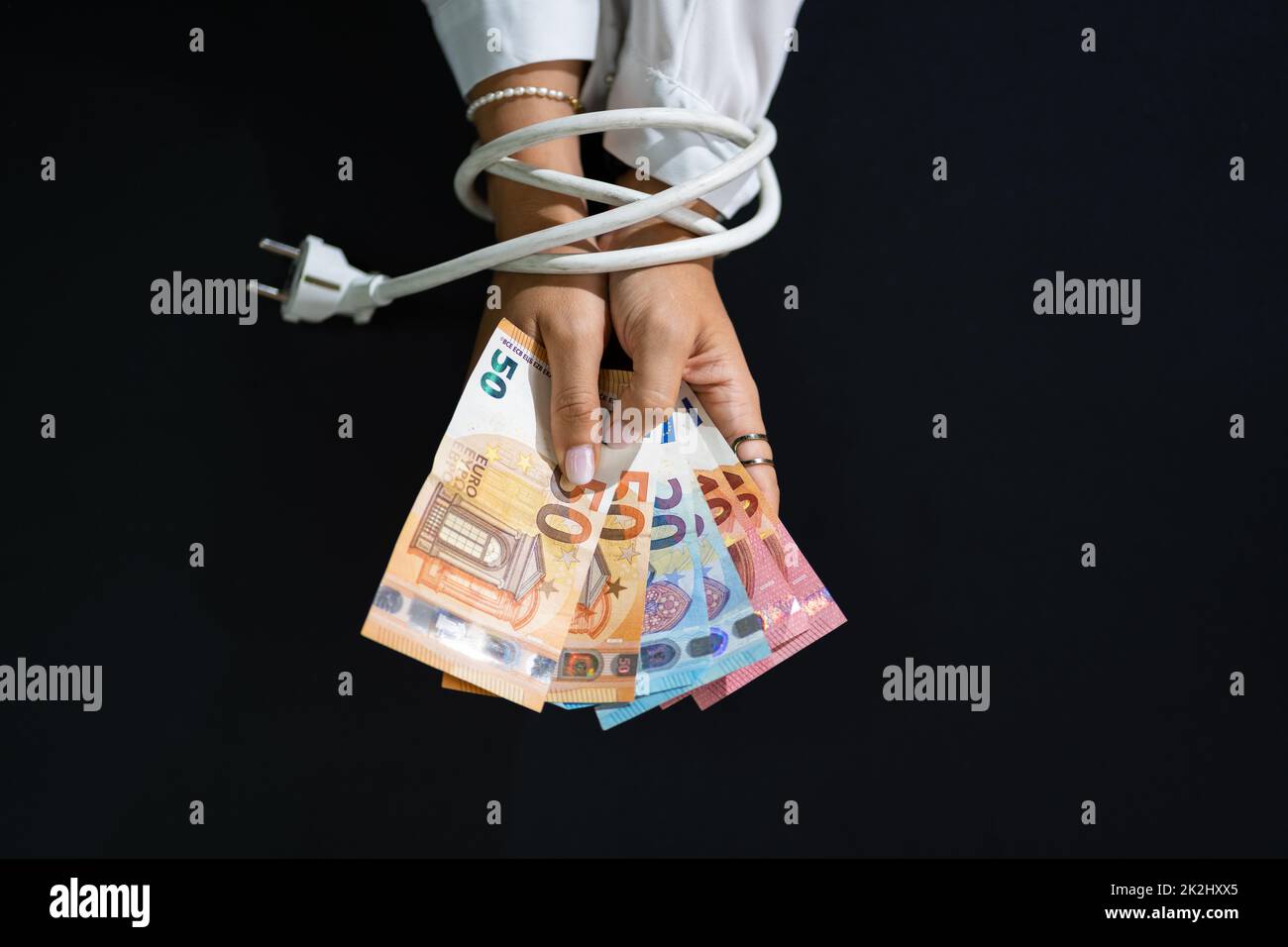 Energy Price Crisis In Europe. Hands Tied In Expensive Electricity Stock Photo