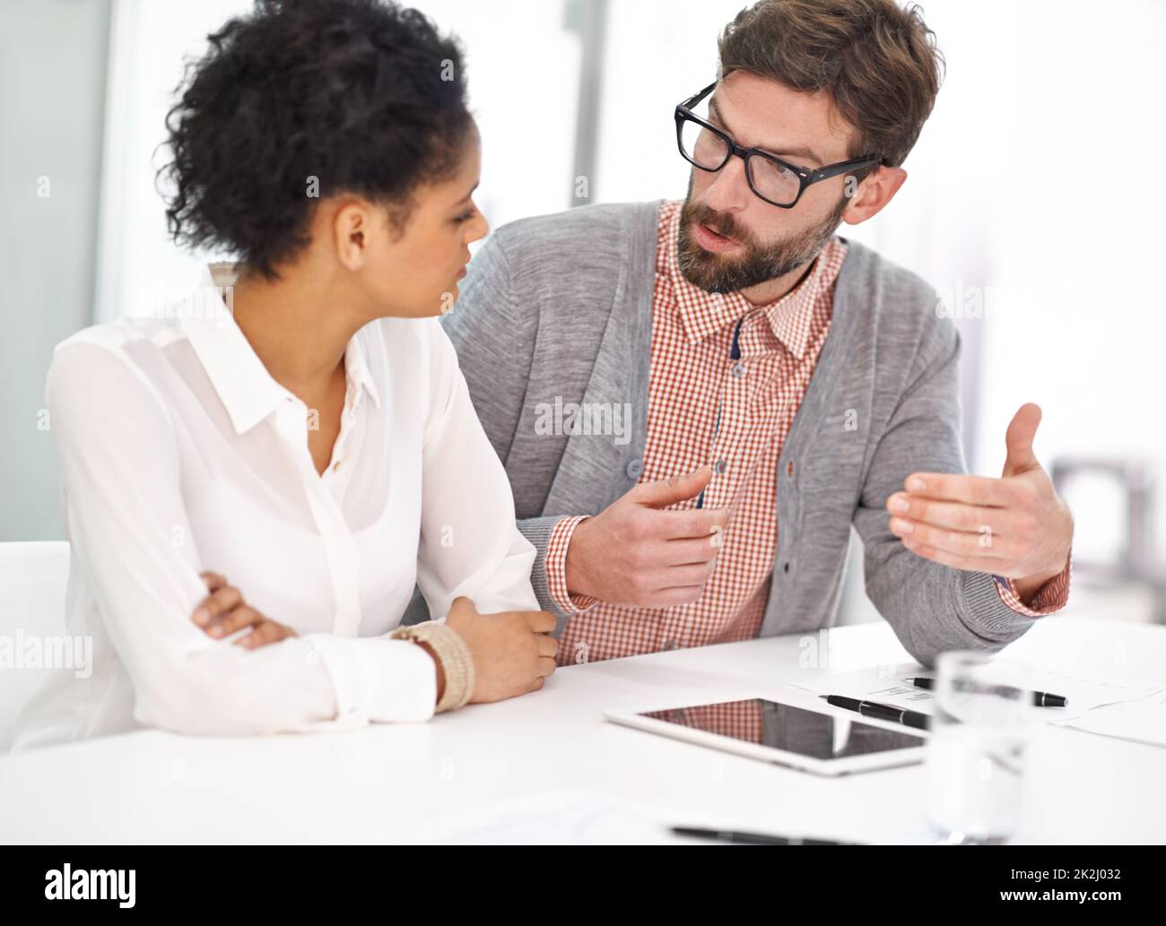 Making his point. Shot of two young business professionals having a meeting. Stock Photo