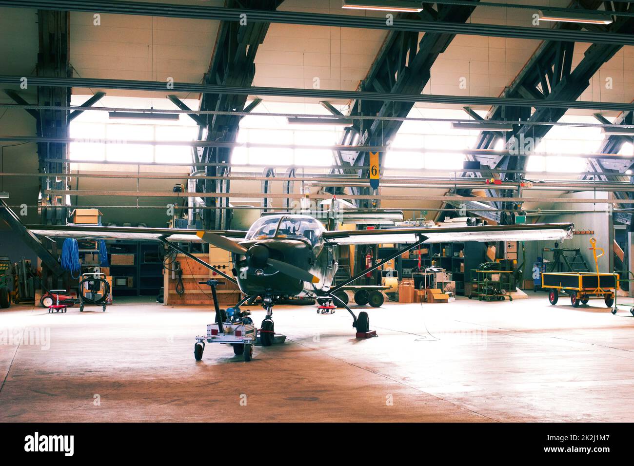 Ready for the next flight. Shot of a light aircraft in a hanger. Stock Photo
