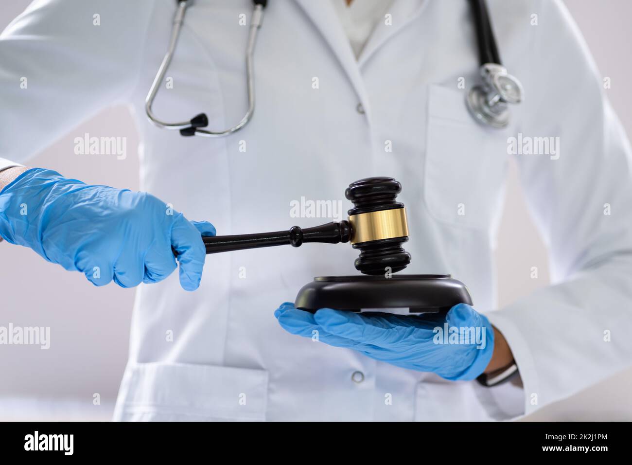 Medical Doctor Malpractice And Attorney Gavel In Courtroom Stock Photo