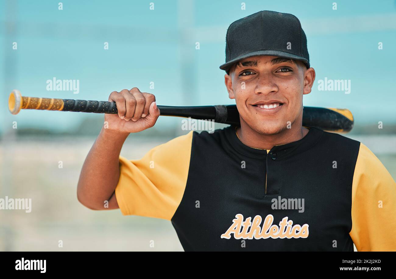 Baseball player posing for the camera Stock Photo - Alamy