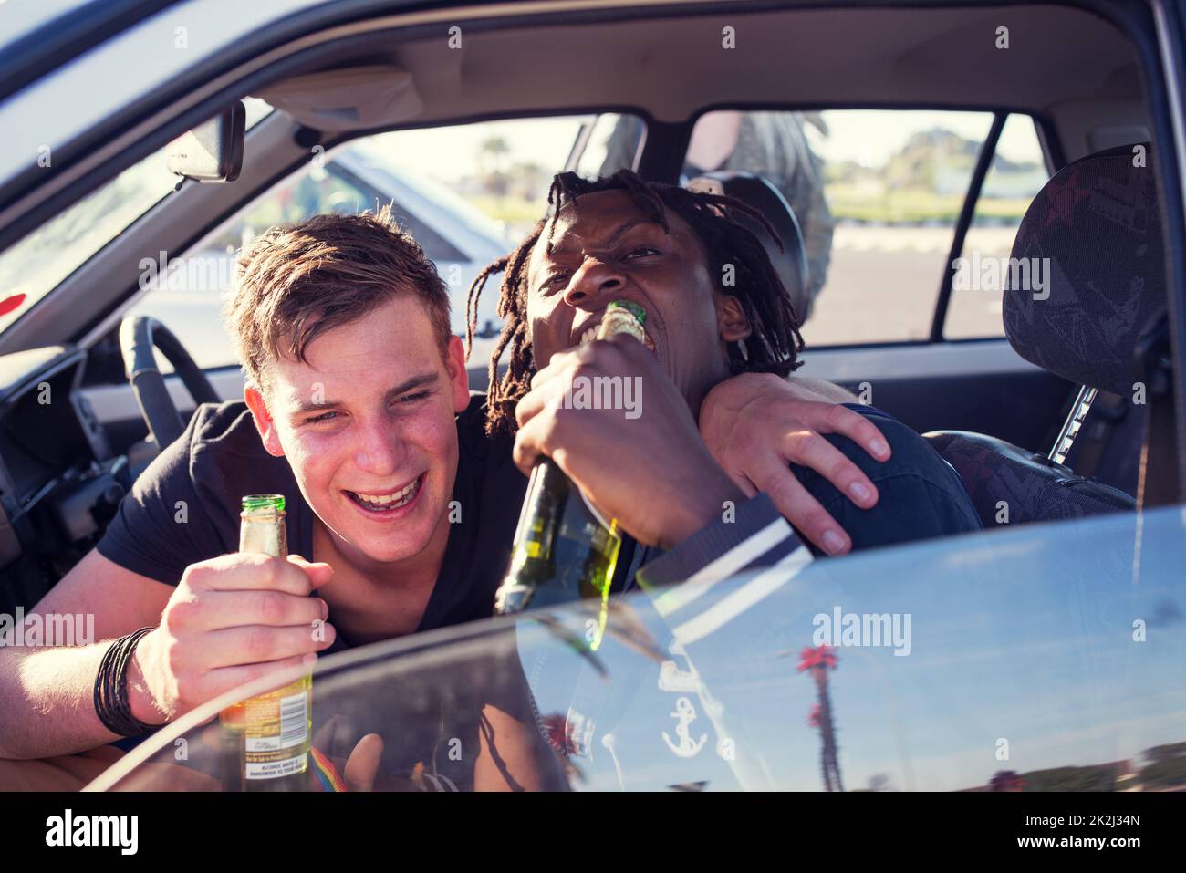Were drinking, but we aint driving. Real party of guys and girls getting drunk. Stock Photo