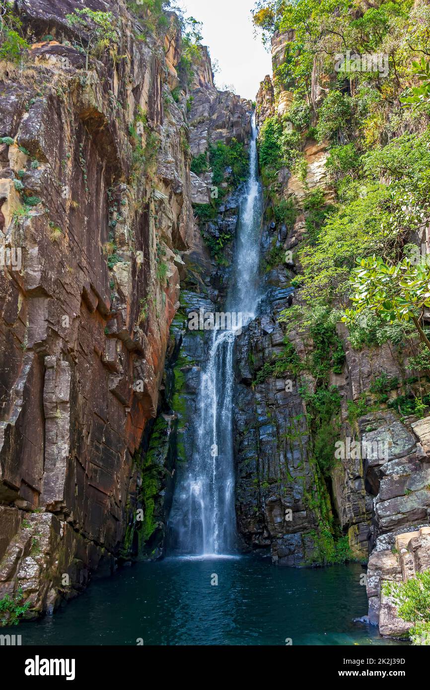 Beautiful waterfall called Veu da Noiva between moss covered rocks and ...